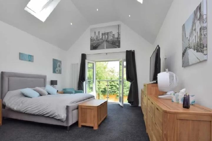 Like all rooms in this home, the master bedroom is bathed in natural sunlight, it also contains a balcony and a king size bed. It could even be converted into a makeshift office.