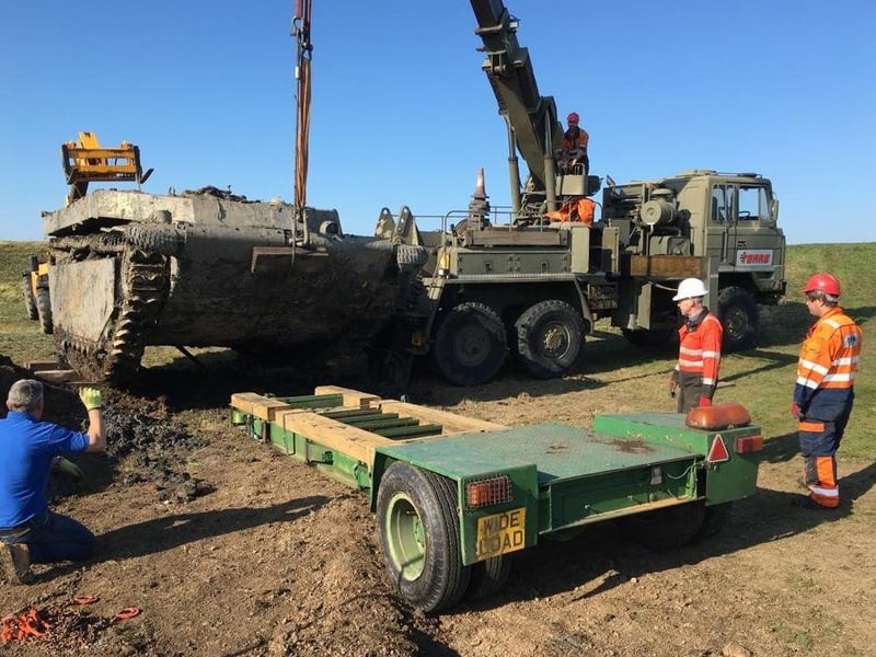 The Buffalo is carefully lowered on to a trailer.