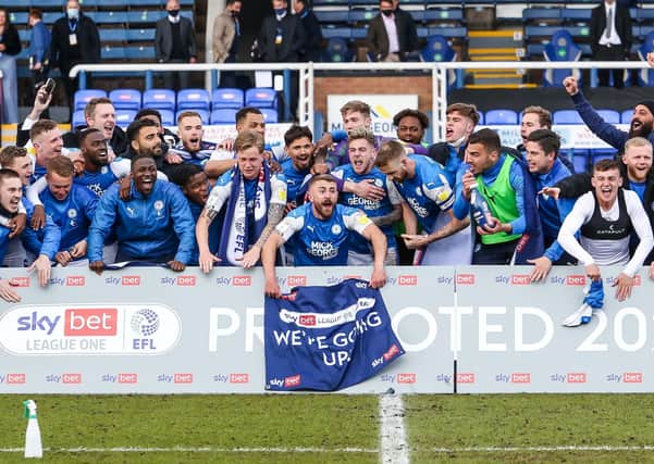 At last Posh players and staff can celebrate promotion! Darragh MacAnthony is back row on the left. Photo: Joe Dent/theposh.com.