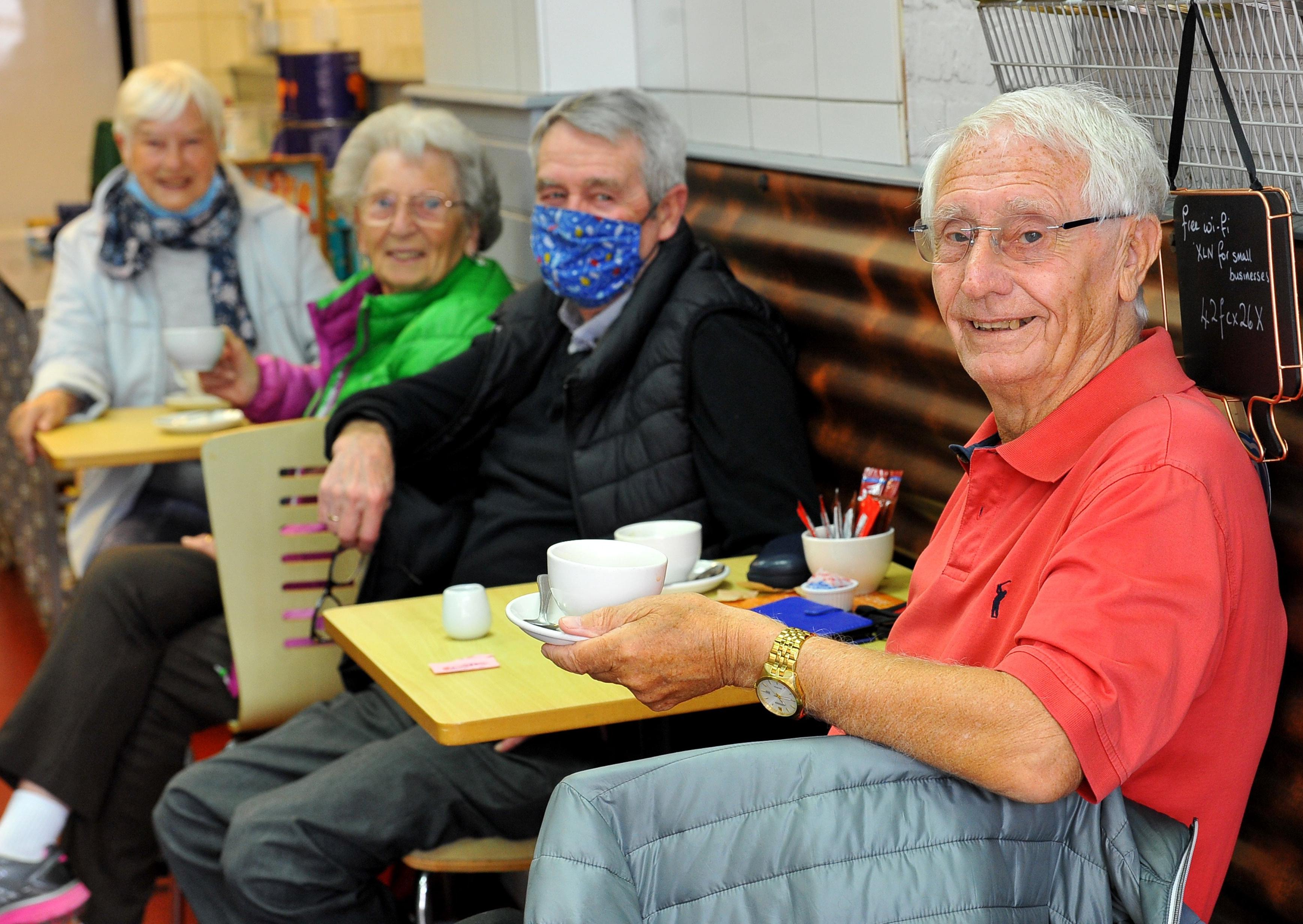 People enjoying a bite to eat at Lynne's Cafe in Church Walk. Pic S Robards SR2105171 SUS-210517-165123001