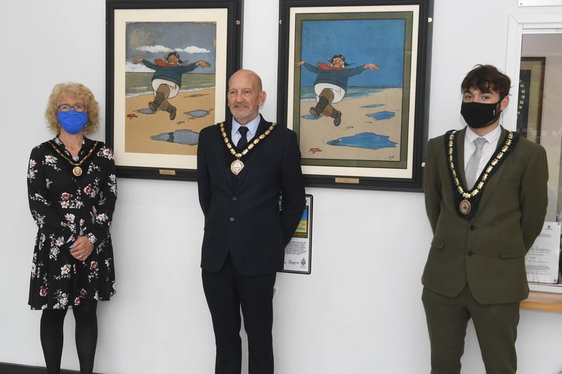 Paintings on display with Skegness Mayoress Jane Burnham, Mayor Coun Trevor Burnham and Deputy Mayor Coun Billy Brookes.