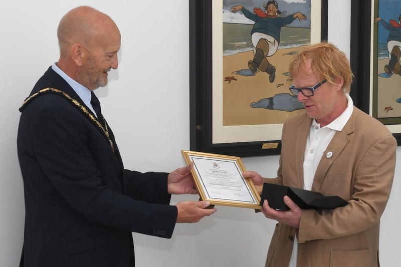 John Byford receives the Honoured Citizen award from Mayor of Skegness Coun Trevor Burnham.