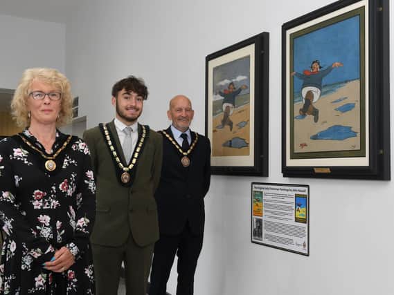 Skegness Mayoress Jane Byford, Deputy Mayor Coun Billy Brookes and Mayor Coun Trevor Burnham at the unveiling of original renovated Jolly Fisherman paintings in Skegness.