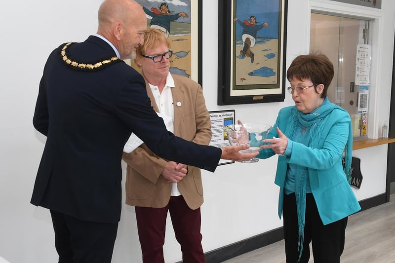 Janice Sutton receives the Skegness Community Award from Mayor Coun Trevor Burnham, with John Byford.