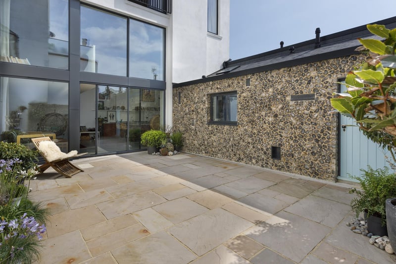 Sliding doors from the kitchen lead to the property's courtyard