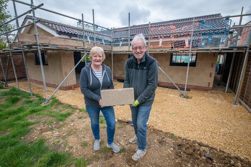 Husband and wife Dave Turner and Olwyn Cornwell help lift some of the blocks for their new home in Market Deeping.
Copyright Mike Sewell 202114th May 2021(Commissioned by Emily Mahon - Unsworth Sugden)