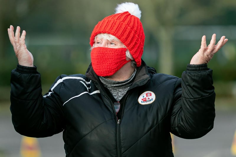 A Crawley Town fan enjoys being back at the ground for the first time for the Barrow game