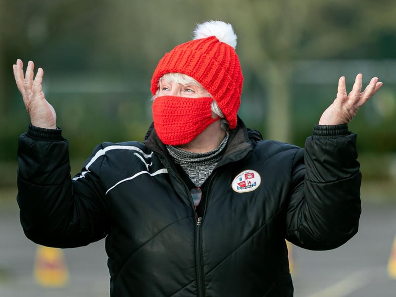 A Crawley Town fan enjoys being back at the ground for the first time for the Barrow game