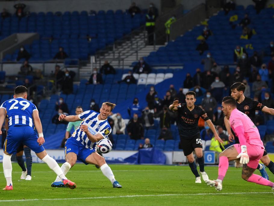 Dan Burn fires home the winner for Brighton against Man City at the Amex Stadium