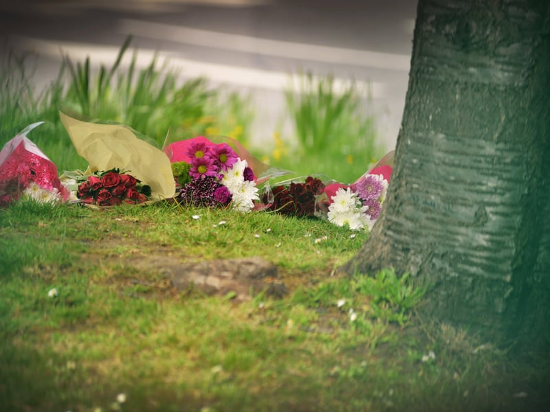 Floral tributes at Bexhill Academy May 25 2021. SUS-210525-123233001