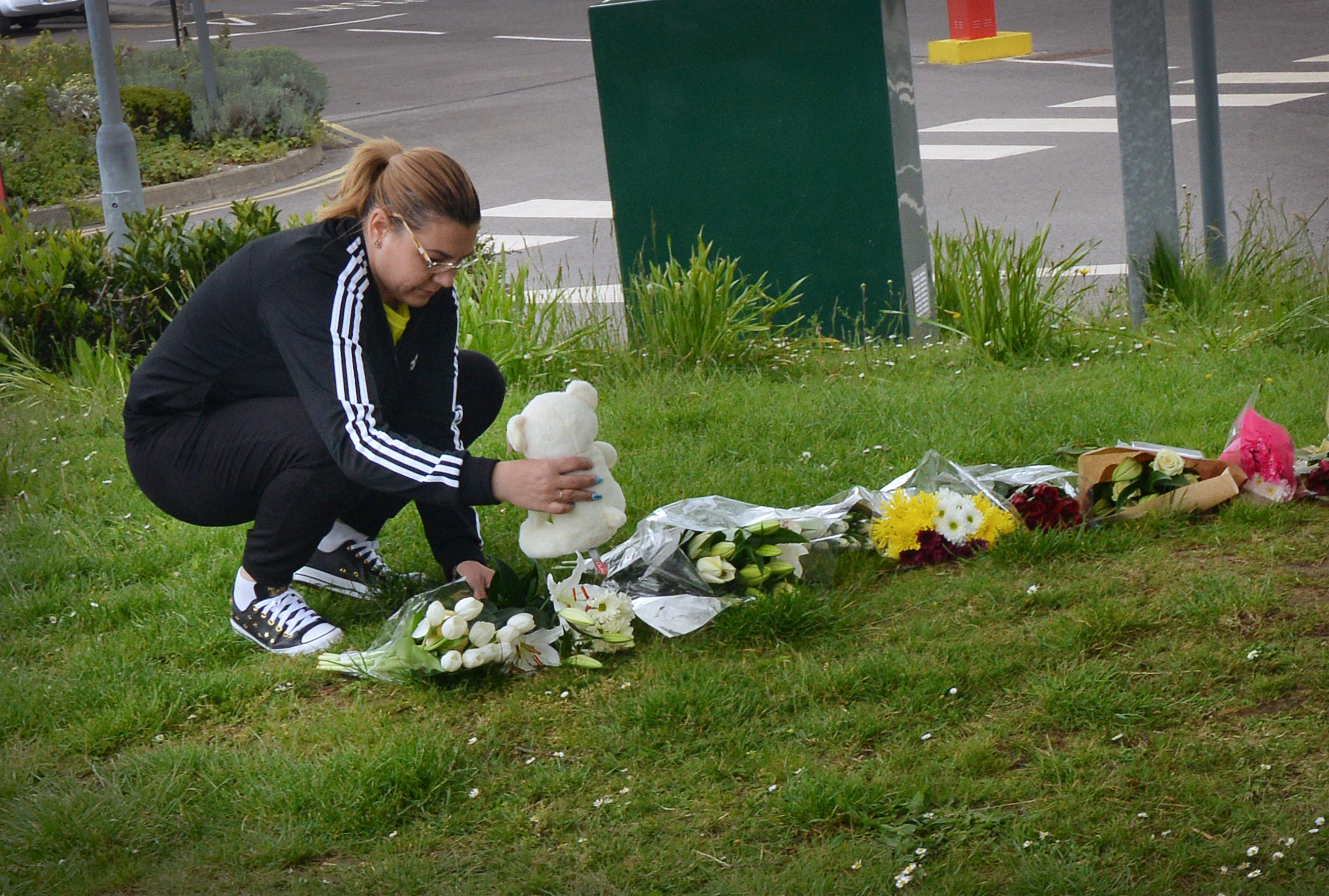 Floral tributes at Bexhill Academy May 25 2021. SUS-210525-123135001