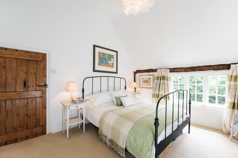 This delightful bedroom contains stunning views of the countryside