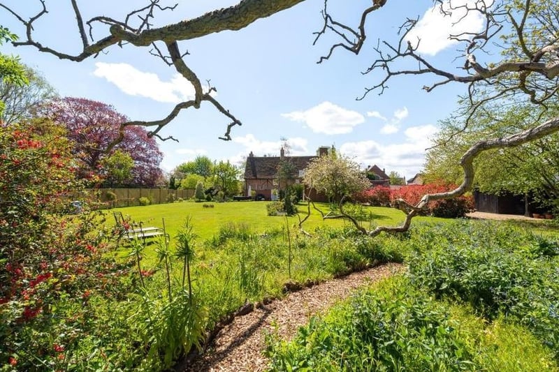 The bottom of the garden is an enchanting place to stroll and spend summer evenings