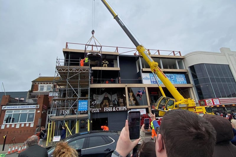 Crowds watch as Lamborghini is hoisted into Skegness bar