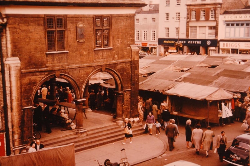 The Corn Market and market stalls in Cathedral Square in the early 60s.