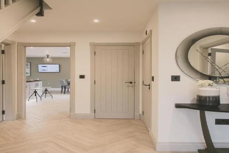 This is your view as you enter the home. You'll pass both the master bedroom and lounge en route to the open plan kitchen and dining room directly ahead.