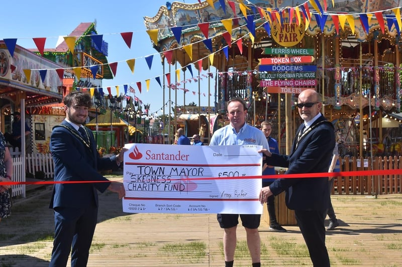 Mayor of Skegness Coun Trevor Burnham and Deputy Mayor Coun Billy Brookes receive a cheque for £500 for the Mayor's charities from Henry Chipperfield of Skegness Vintage Fair.