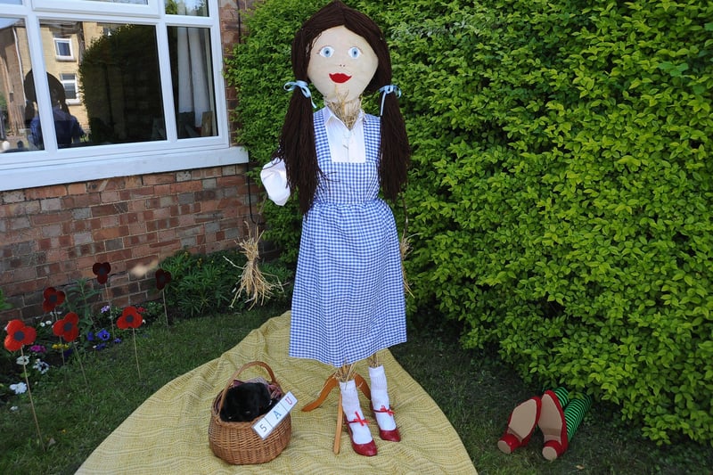 Scarecrow Festival at Werrington.   Dorothy (Wizard of Oz) at The Green EMN-210529-155014009