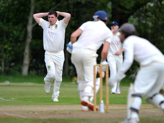 Adam Butler bowling for Ansty against Slinfold