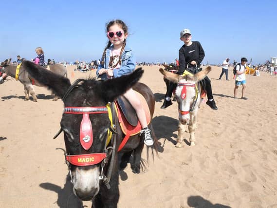 Fearne Harrison, 3, enjoying a ride on the donkeys on Skegness beach.