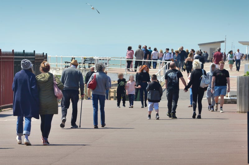 People enjoying the bank holiday weekend on May 30 in Hastings.

View of the seafront heading towards St Leonards. SUS-210531-071547001
