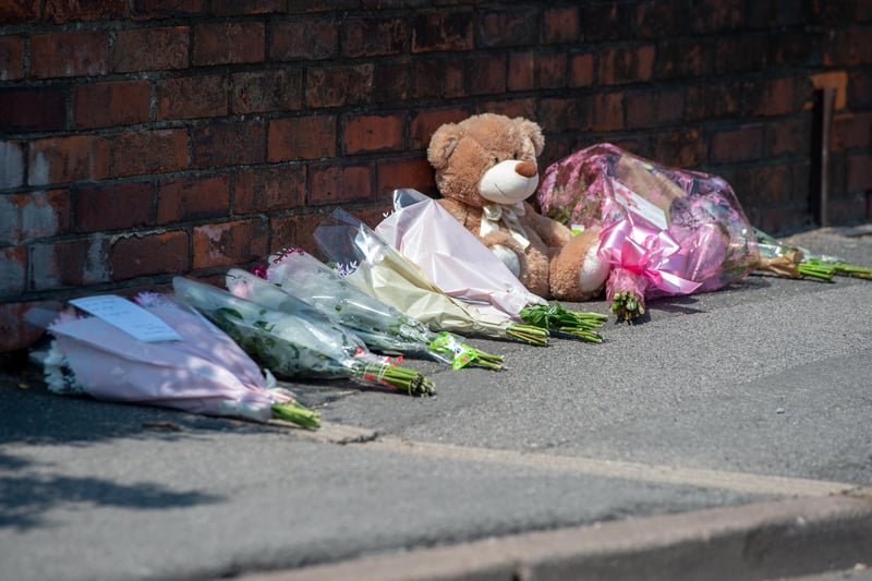 Tributes left outside the property in High Holme Road, Louth.