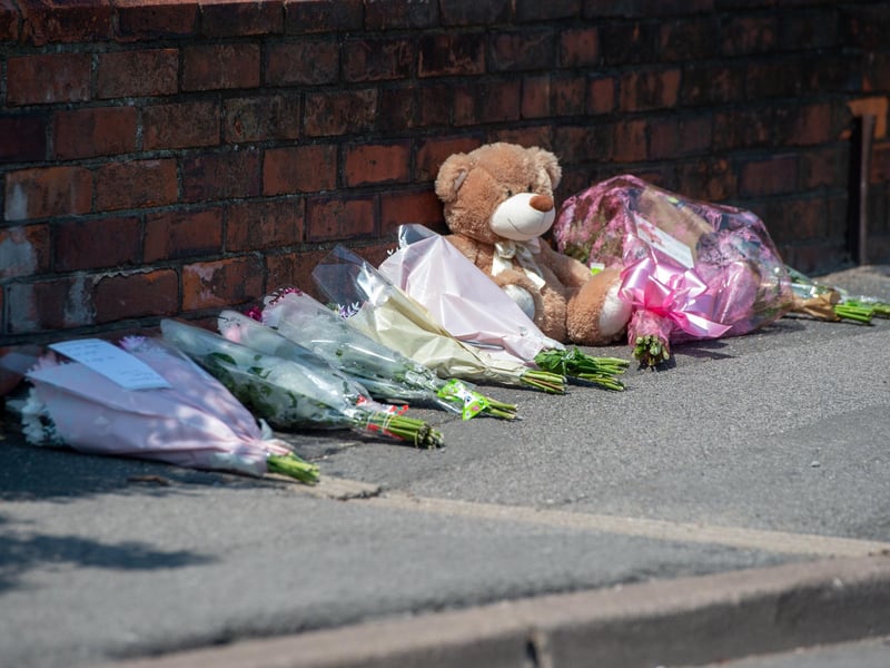 Tributes left outside the property in High Holme Road, Louth.