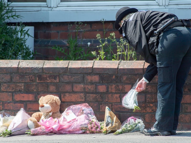 Tributes left outside the property in High Holme Road, Louth.