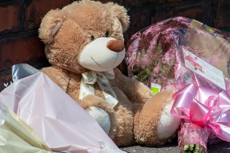 Tributes left outside the property in High Holme Road, Louth.