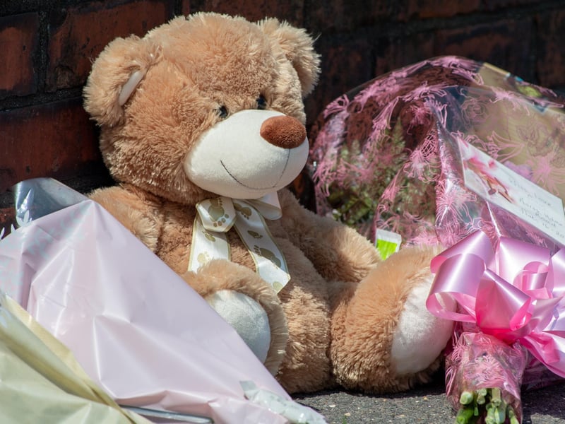 Tributes left outside the property in High Holme Road, Louth.