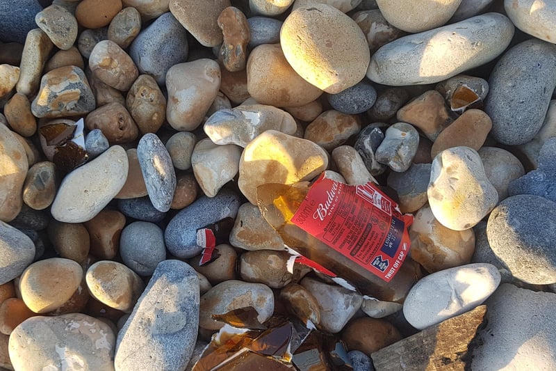 Smashed bottles on Hastings beach. Picture: Garry Coogan SUS-210206-104648001