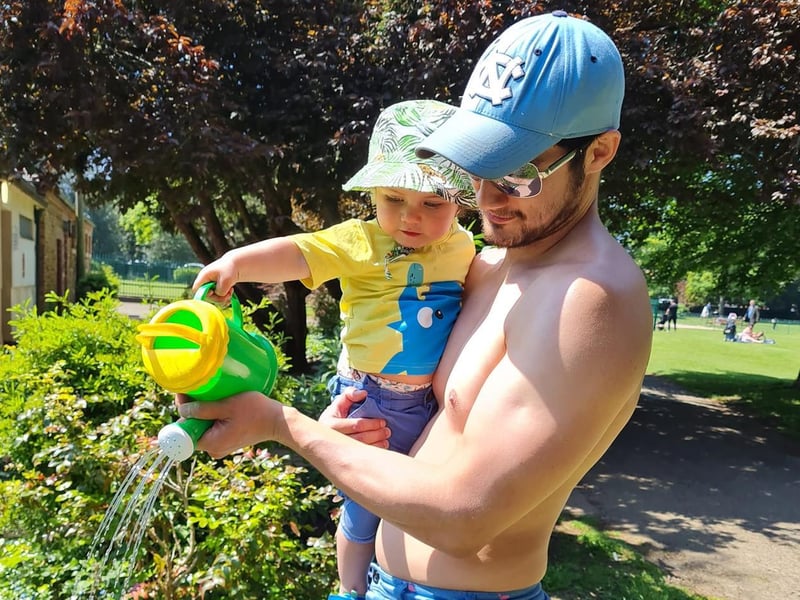 Watering the flowers in Abington Park.