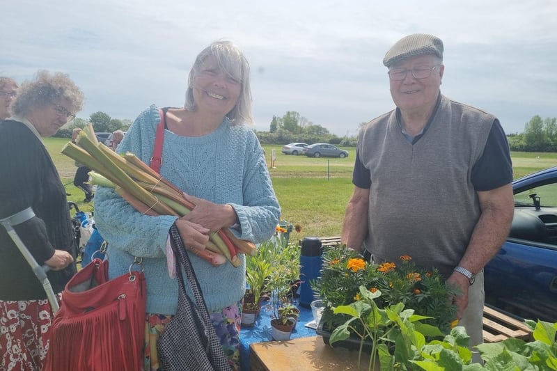 Angela Batchelor, who has a cottage in Alford, got some tips on growing rhubarb from stallholder John Jaques of Old Leake.