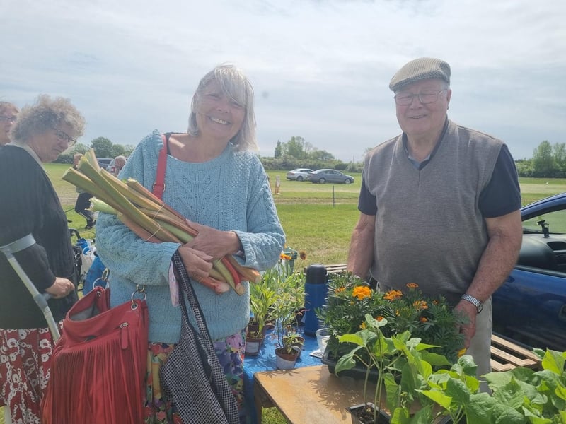 Angela Batchelor, who has a cottage in Alford, got some tips on growing rhubarb from stallholder John Jaques of Old Leake.