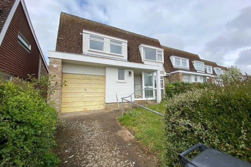 A three bedroom detached house. Price: £295,000.