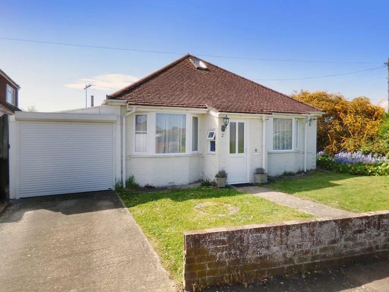 A spacious detached bungalow on a large corner plot. Price: £350,000.