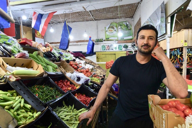 Qader Paja at a vegetable stall