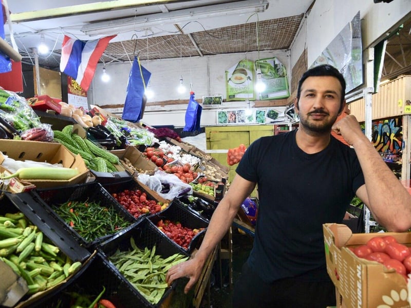 Qader Paja at a vegetable stall