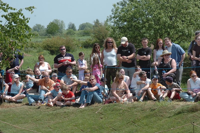 Visitors watching a gladiator tournament at Flag Fen.