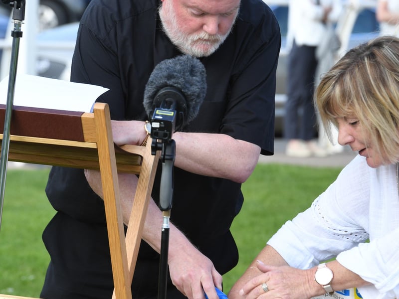 The vigil in for Bethany and Darren 'DJ' Henson in Chapel St Leonards, led by Rev Richard Holden.