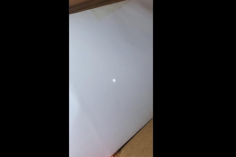 Chron reader Joanne Mackey had some luck with her homemade pinpoint projector, one of the safest and crafty ways to see the moon in front of the sun.