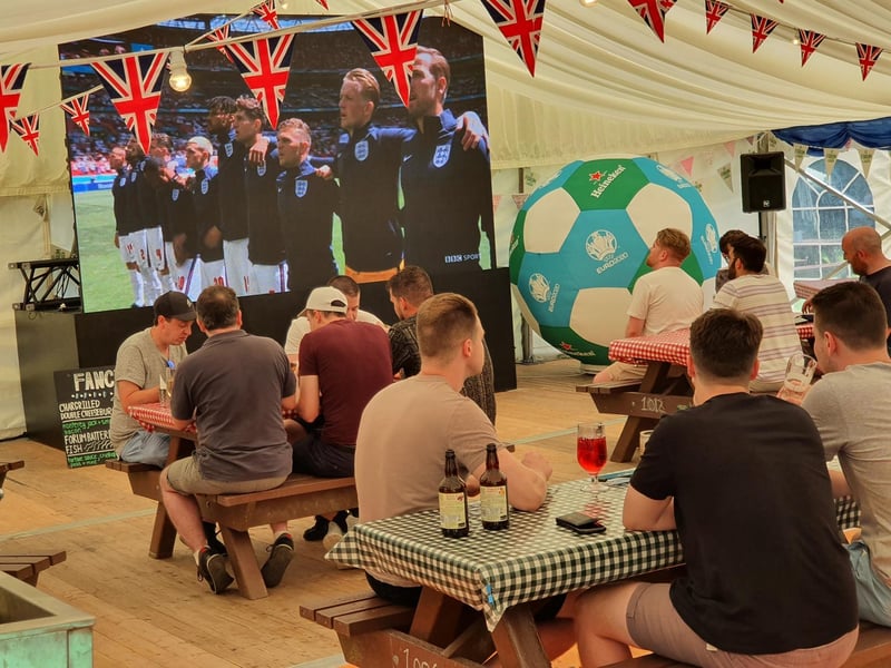 Fans watch the England team