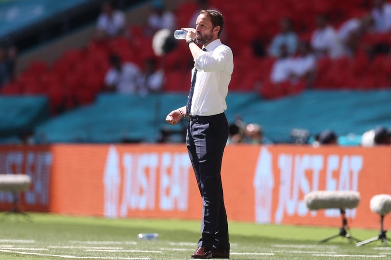 Gareth Southgate takes a drink in the searing heat at Wembley