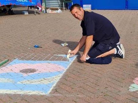 Ady Findley, a member of the Skegness branch of the Royal British Legion, was on site at 5.30am creating the centrepiece for the field of poppies, which is the RBL's new logo.