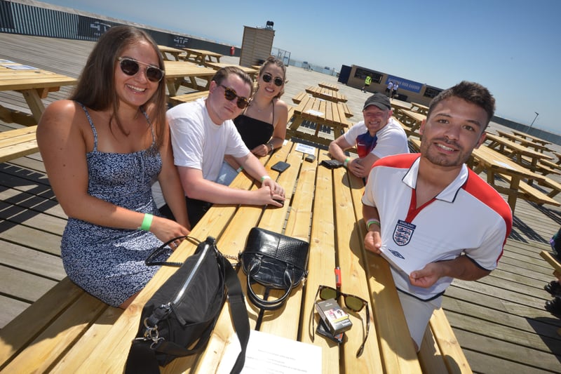 Football fans getting ready to watch England V Croatia at the Bier Garden on Hastings Pier. SUS-210614-071053001