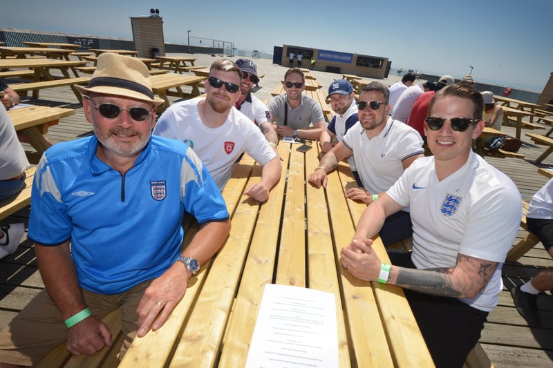 Football fans getting ready to watch England V Croatia at the Bier Garden on Hastings Pier. SUS-210614-071118001
