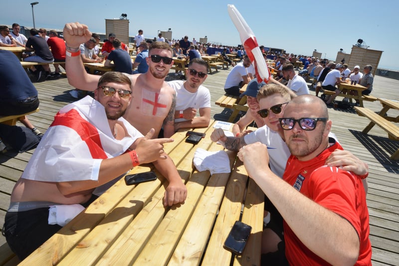 Football fans getting ready to watch England V Croatia at the Bier Garden on Hastings Pier. SUS-210614-070210001