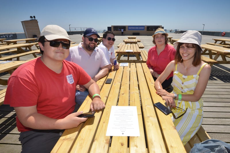 Football fans getting ready to watch England V Croatia at the Bier Garden on Hastings Pier. SUS-210614-071144001