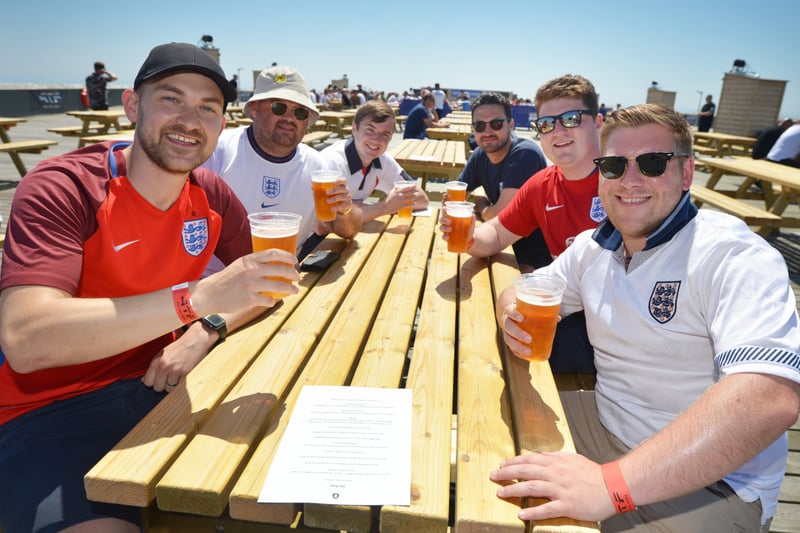 Football fans getting ready to watch England V Croatia at the Bier Garden on Hastings Pier. SUS-210614-071255001
