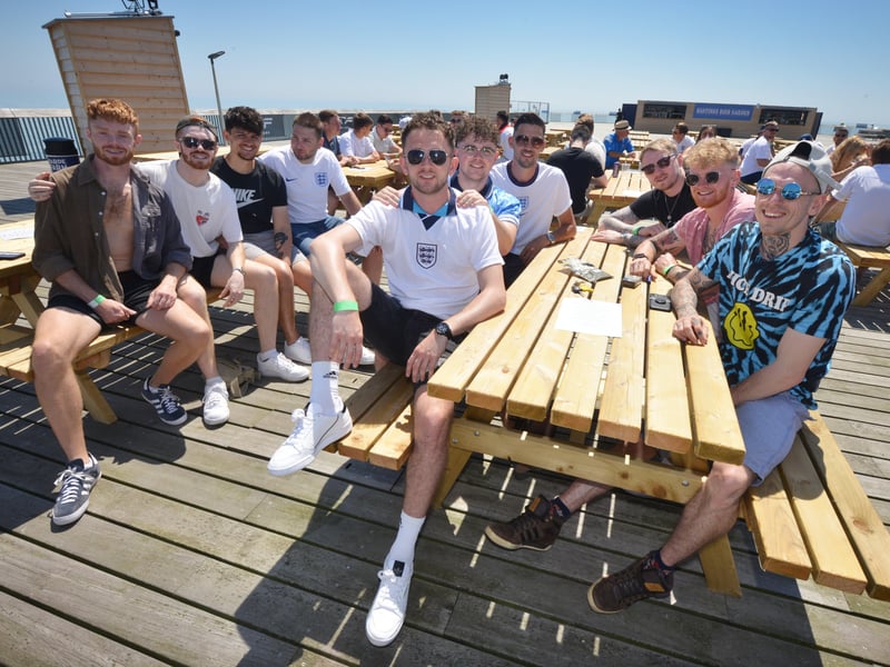 Football fans getting ready to watch England V Croatia at the Bier Garden on Hastings Pier. SUS-210614-070848001